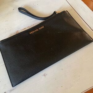 EUC MK black pebble leather wristlet